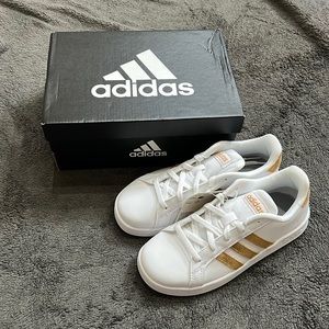 Adidas Kids sneakers. White with gold accents. Brand new with tags, never worn!